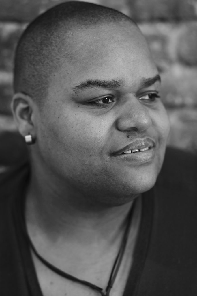 Toshi Reagon looks off into the distance for a headshot.