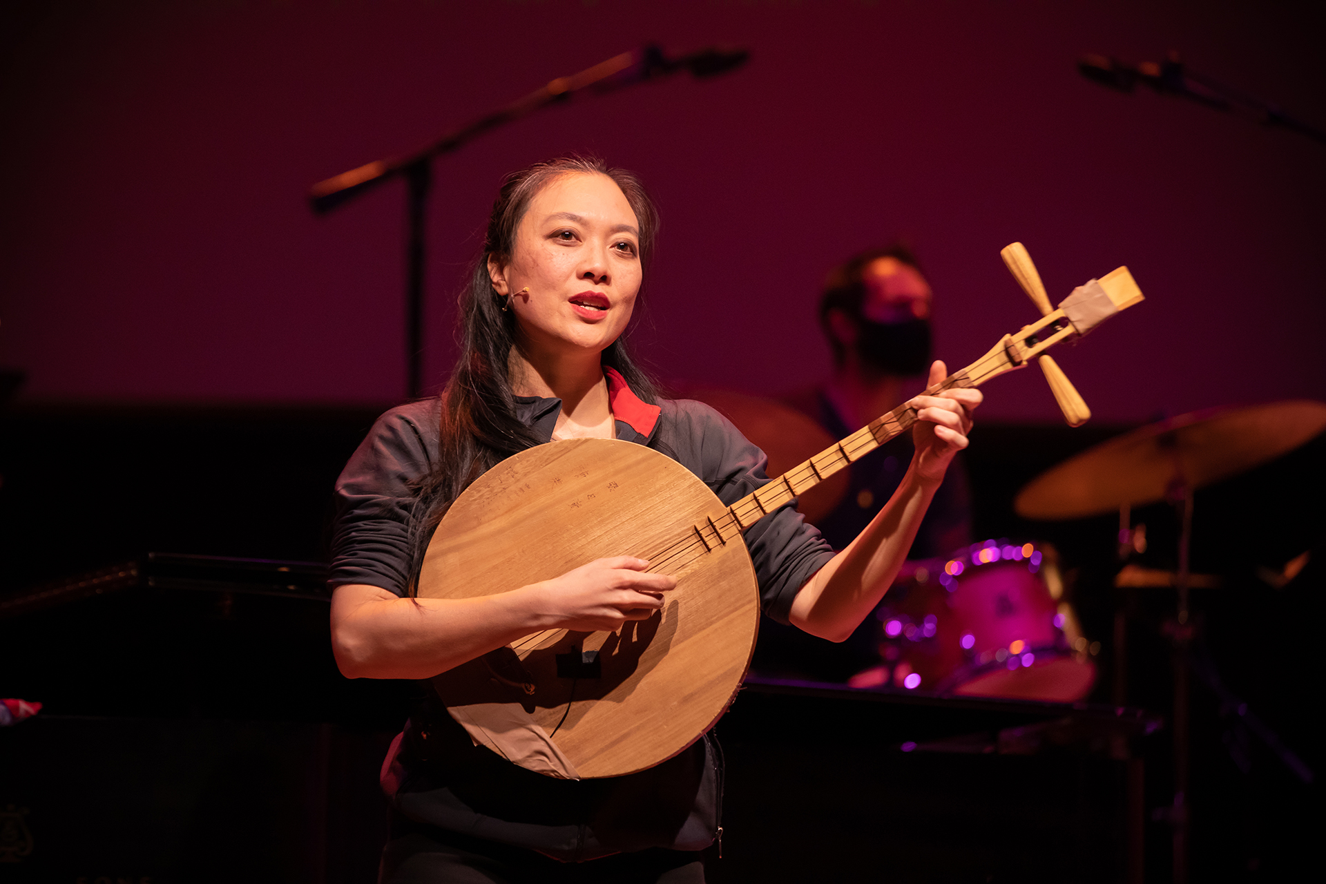Jen Shyu poses with an instrument.